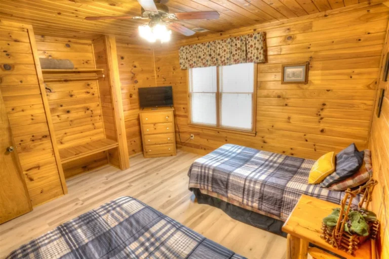 Forest Haven Cabin Bedroom with Three Beds near Helen, GA