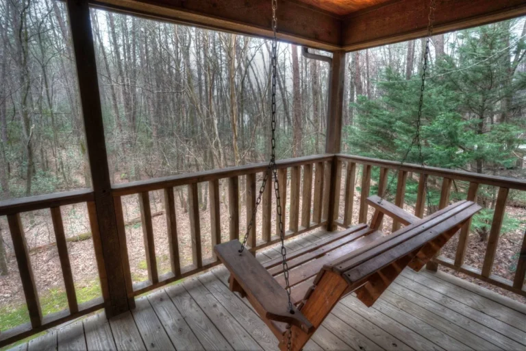 Signature 30-foot back porch with swing at Forest Haven cabin near Helen GA